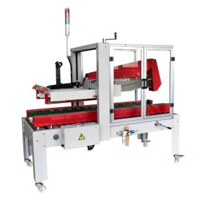 Máquina de fechar caixas automática RUBBER com dobrador de abas vermelho sob guarda de segurança transparente